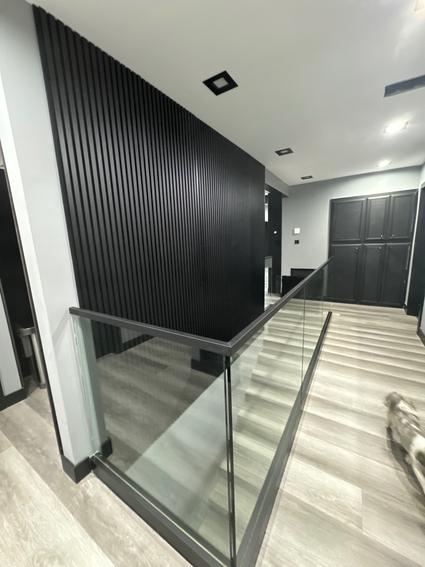 Interior black slat feature wall and modern staircase