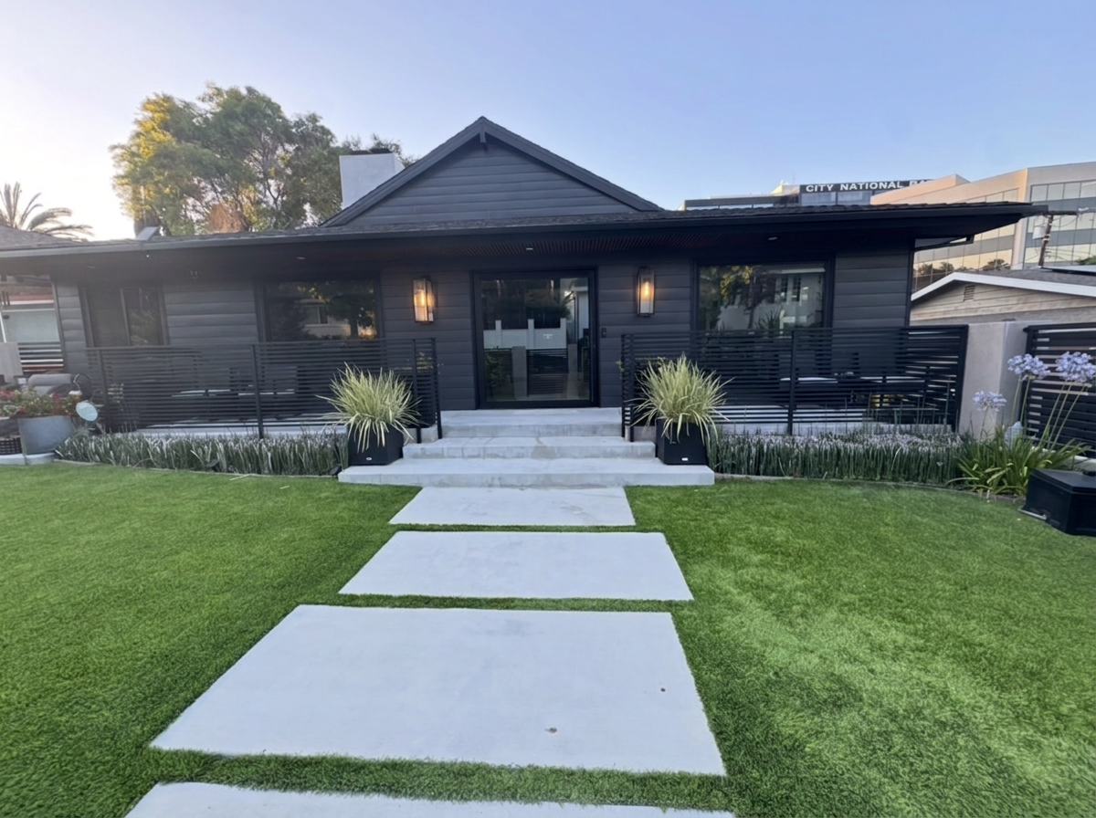 Modern Encino exterior remodel with charcoal siding and black-framed entry