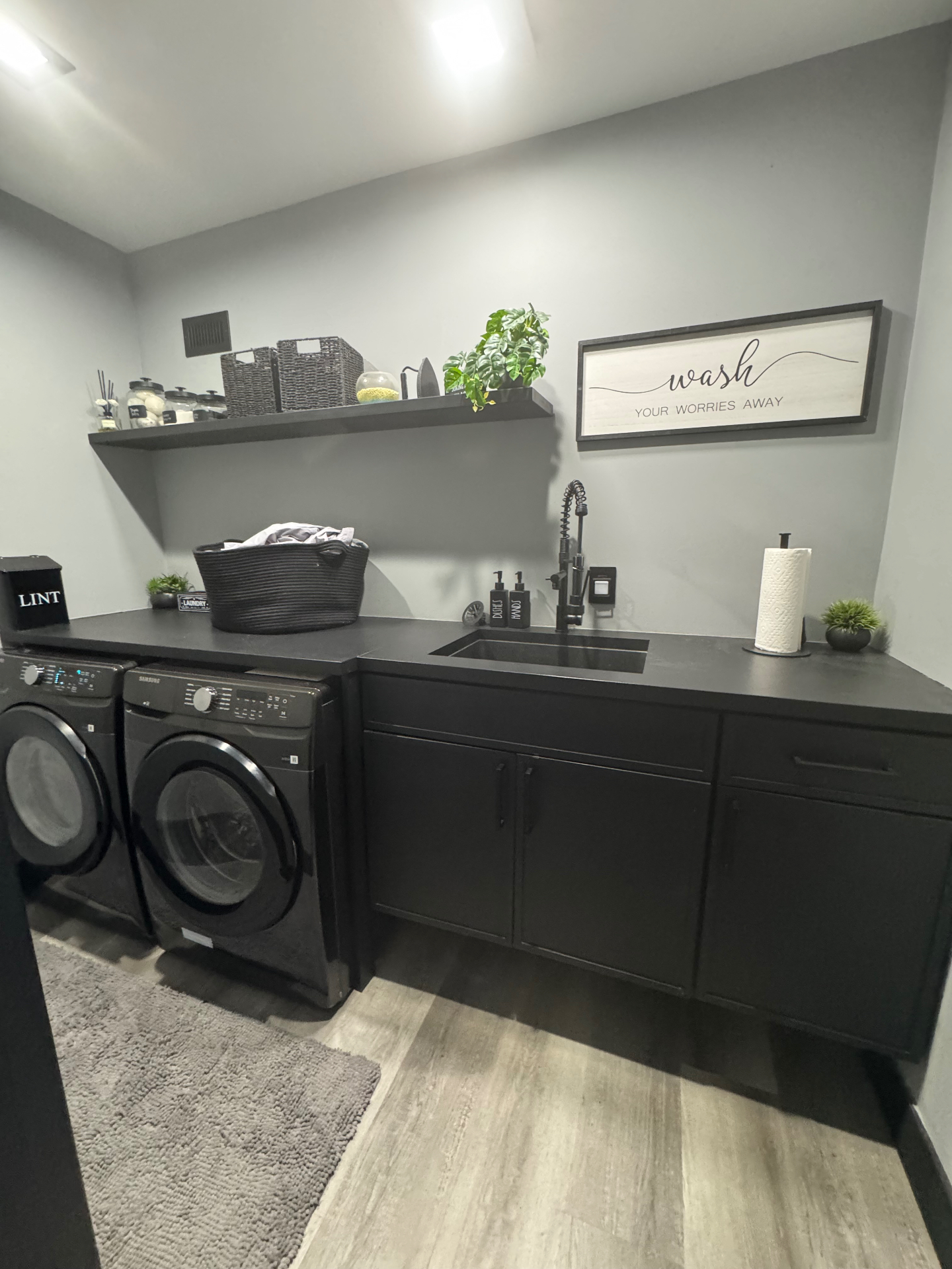 Modern laundry room with new electrical and plumbing